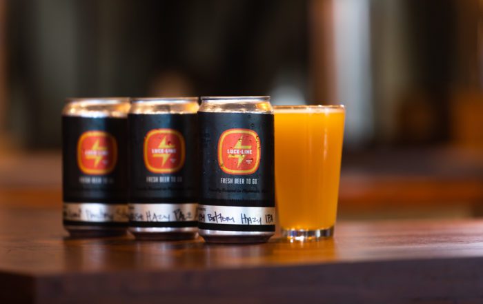 Crowlers of beer at Luce Line Brewing Co. in Plymouth • Photo by Jordan Wipf