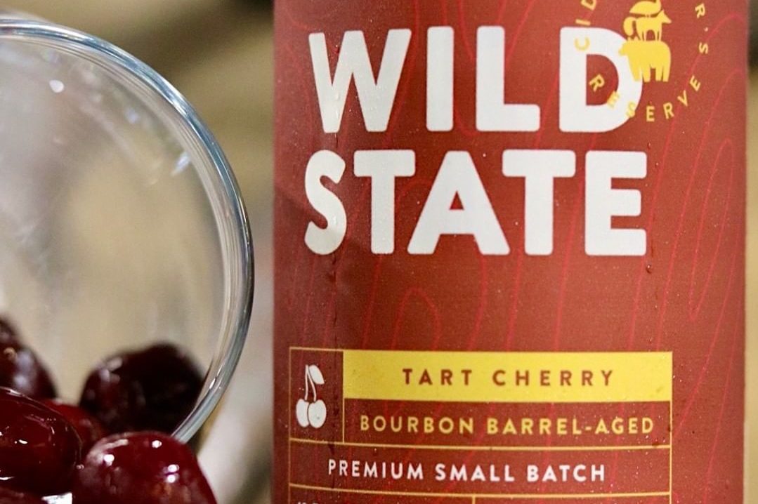 Wild State Tart Cherry Bourbon Barrel-Aged Cider • Photo via Wild State Cider